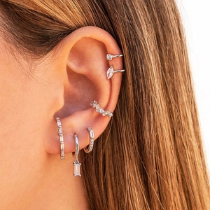 S925 sterling silver hoop earrings set with sparkling zircon crystals on female ear