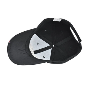 Detail view of the baseball cap's inner lining featuring 100% acrylic material tag