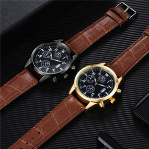 Close-up of luxury chronograph watch with brown leather strap and dual color cases