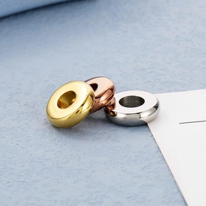 Macro shot of 18K gold and silver plated stainless steel spacer beads for DIY jewelry