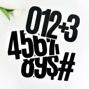 Macro view of 6-inch black waterproof vinyl number stickers with currency and math symbols