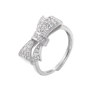 Close-up of silver bow ring set with sparkling zircons and delicate knot details