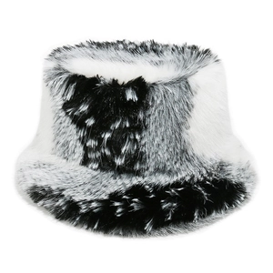 Detailed close-up of fluffy black and white cow print faux fur bucket hat texture