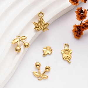 Golden stainless steel pendants in maple leaf, cherry, flower, and clover shapes