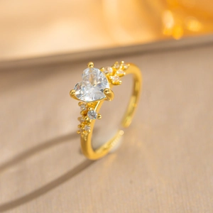 Elegant gold heart-shaped zircon ring with micro-paved small white crystals