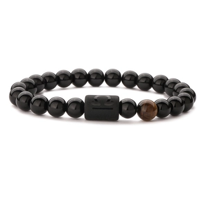 Elastic zodiac bracelet with black agate beads and Libra symbol on a matte centerpiece