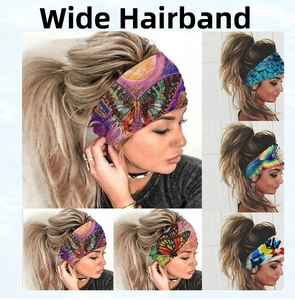 Detail view of colorful butterfly and bohemian patterns on wide elastic headbands