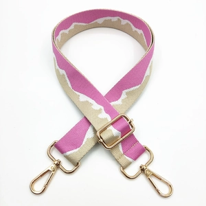 Adjustable woven strap with pink wave pattern and gold metal hardware for shoulder bags