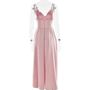 Detail of pink silk V-neck jumpsuit with back zipper and flowing wide-leg trousers