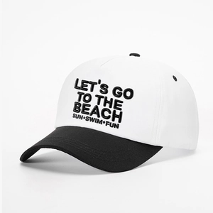 Close-up of LETS GO TO THE BEACH embroidery on black and white cotton baseball cap