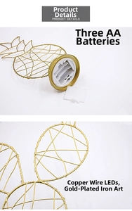 Detail view of gold iron pineapple lamp showing wire structure and AA battery compartment