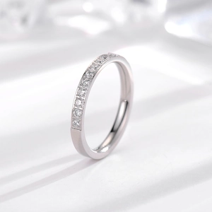 Detail of silver titanium ring with micro-set clear stones in channel setting