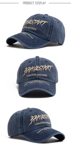 Detail of vintage washed blue cotton baseball cap with 3D embroidery on front and side