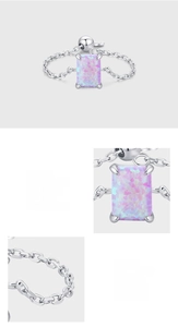 Detailed macro shot of S925 sterling silver prong setting and rectangle opal ring
