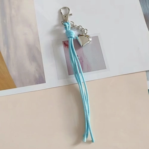 Creative braided light blue cord keychain with a polished silver heart charm and lobster clasp
