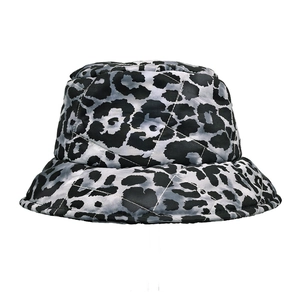 Detail of grey leopard print bucket hat featuring diamond quilting and warm cotton padding