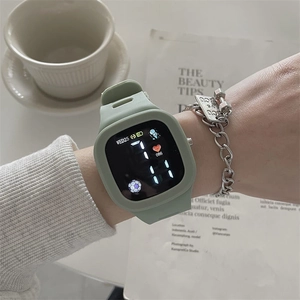 Detail of mint green LED digital sports watch featuring square screen and silicone strap