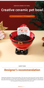 Detail of Santa ceramic pet bowl showing the glossy red glaze and golden buckle finish