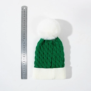 Kids chunky knit dark green Christmas beanie with large white pom-pom and ribbed cuff