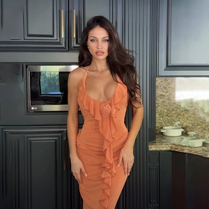 Detail of ruffled V-neckline with 3D handmade rose on a slim fit orange backless dress