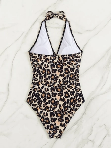 Flat lay of leopard print one-piece swimsuit with halter neck and deep V-neckline