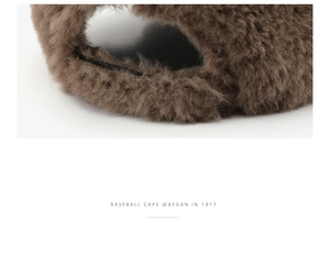 Close-up of deep brown plush baseball cap fabric showing soft faux fur texture