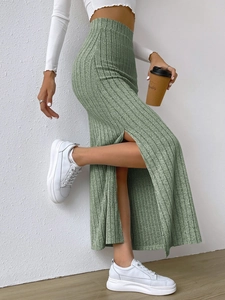 Elegant green high waist long knit skirt with side slit for women in a slim fit style