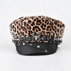 Leopard print baker boy hat featuring punk studs and a metallic spider ornament