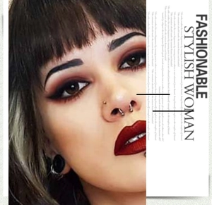 Detail of silver horseshoe septum ring and ball studs on a model for punk style look