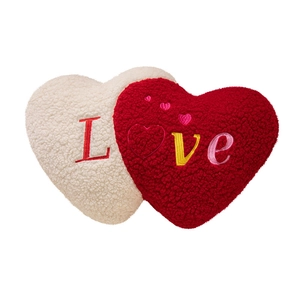 Plush interlocking red and white heart pillows with Love embroidery in sherpa fleece fabric