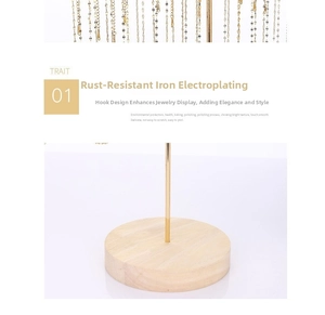 Detail of rustproof electroplated gold iron hooks on a solid wooden jewelry display stand