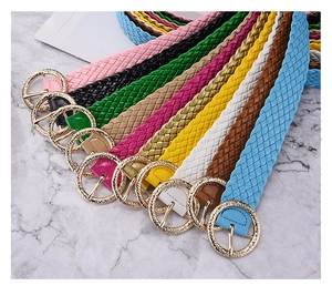 Detailed macro view showing a collection of multi-color braided PU leather waist belts