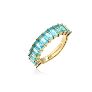 Detail of gold plated ring featuring rectangular blue zircons in a continuous row