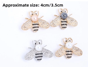 Detailed view of alloy bee brooches with pearls, rhinestones, and dimension markings