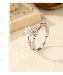 Close-up of S925 silver bypass ring featuring heart moissanite and stone accents