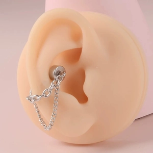 Silver magnetic ear cuff with double chain link design on realistic ear model