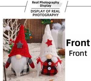 Front view of Christmas faceless gnomes with knit star hats and plaid bodies on snow