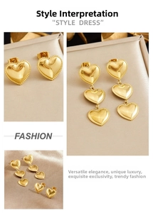 Detail of gold heart earrings set featuring beaded edges and elegant long tassels