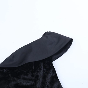 Detail of the off-shoulder neckline on this elegant black velvet bodycon dress