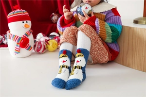 Detailed view of warm winter coral fleece Christmas socks on child model with festive props