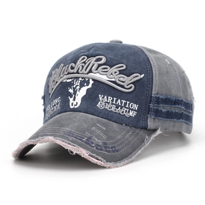 Detailed view of vintage blue baseball cap with BlackRebel embroidery and distressed edges