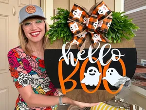 Macro view of wooden Boo door sign with hello lettering and cute ghost details