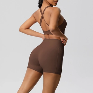 Dark brown two-piece sports bra and high-waisted shorts yoga set with cross back