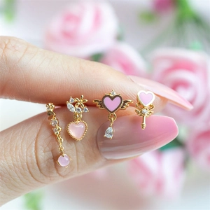 Pink heart jewelry set with gold metal finish and enamel details for women