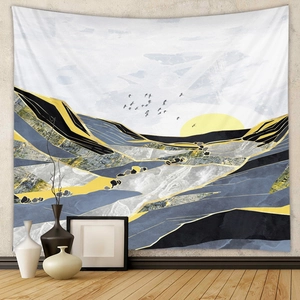 Detailed view of abstract landscape tapestry with gold accents on a beige interior wall