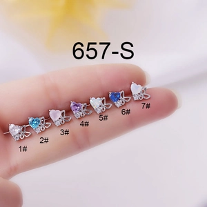 Close-up of titanium steel butterfly stud earrings with colorful heart-shaped zircons
