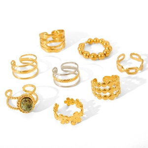 Set of multilayer stainless steel open rings in gold and silver with gemstone inlay