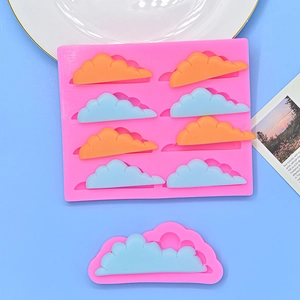 8-cavity cloud silicone mold for cake decorating and chocolate baking on blue background