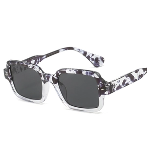 Modern square sunglasses with purple marble texture frame and dark grey lenses for women