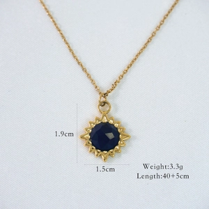 Detail view of 14K gold plated sunflower necklace with size and weight specifications